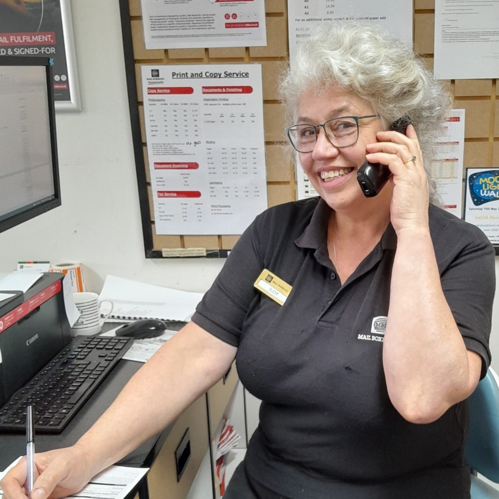 MBE Chichester team member Judy answering the phone